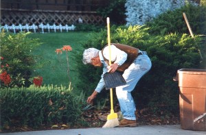 Conrad Pavellas Cleaning up the front yard Nepo Drive, San Jose Around 1995